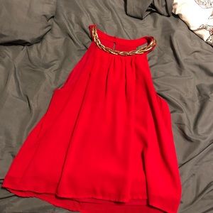 Medium top with gold accent on it